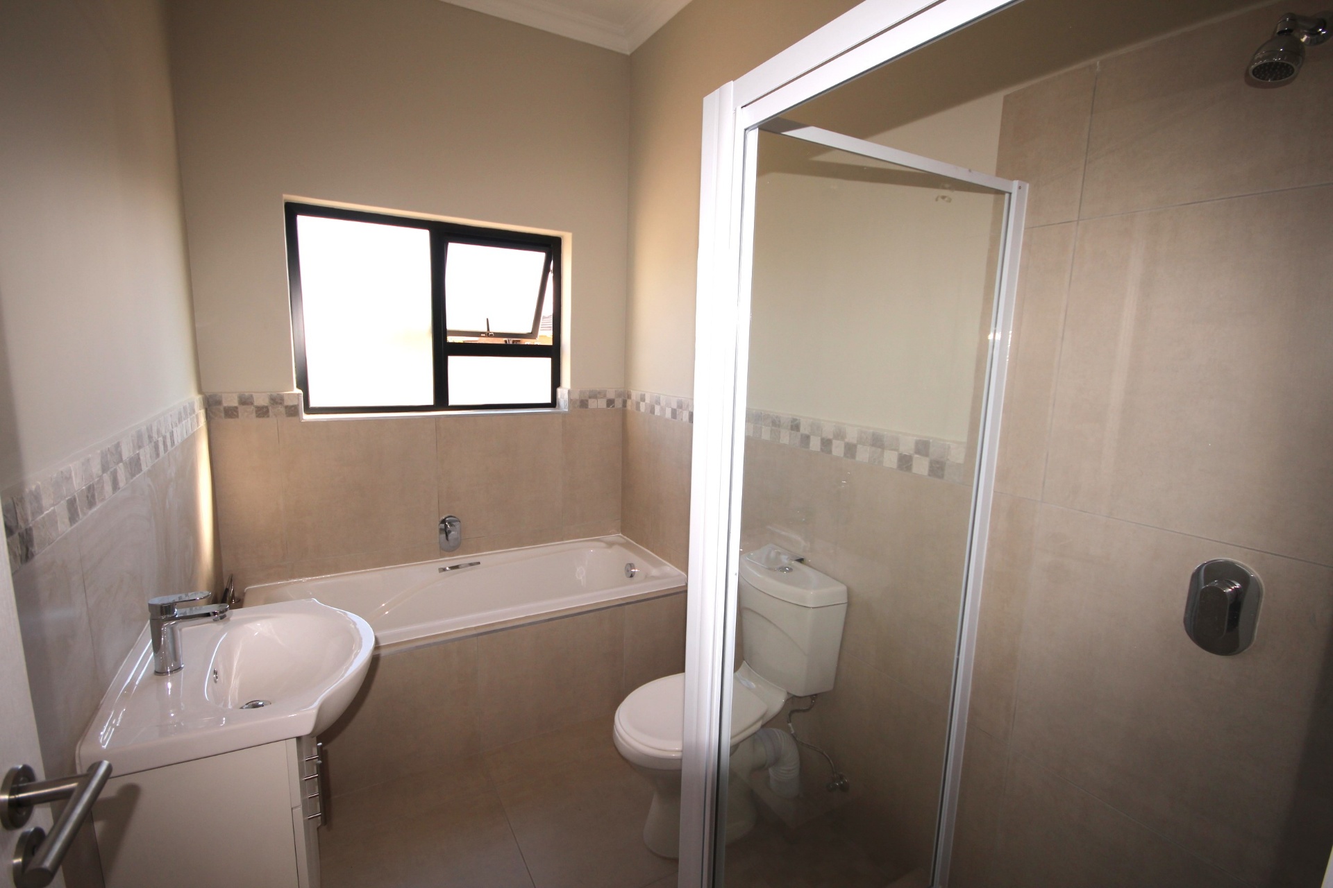 Main bathroom with bath and shower