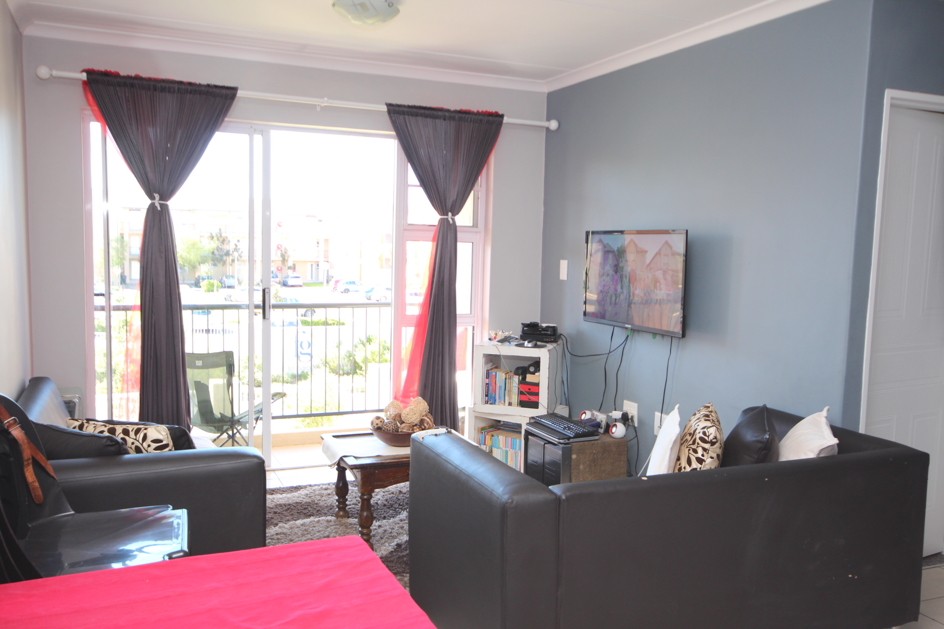 Open-plan lounge with balcony access
